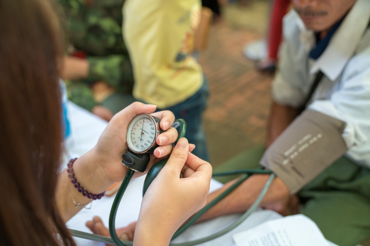 Nurse checks blood pressure
